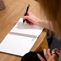 Writing in notebook